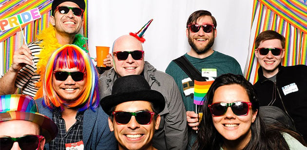 WatchGuard employees at a company holiday party photo booth