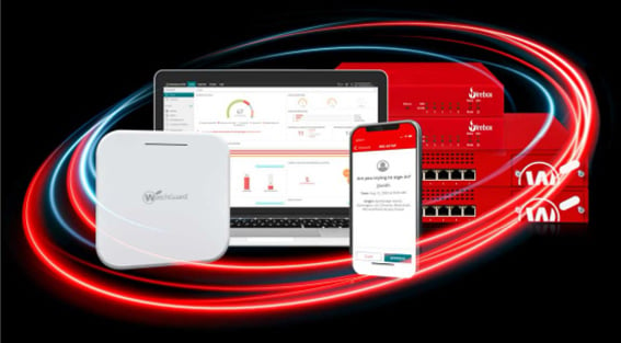 WatchGuard Fireboxes and wireless access points with WatchGuard Cloud screens showing on a phone and a laptop