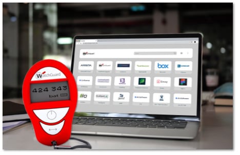 Red AuthPoint hardware token sitting in front of a laptop showing an SSO portal on the screen