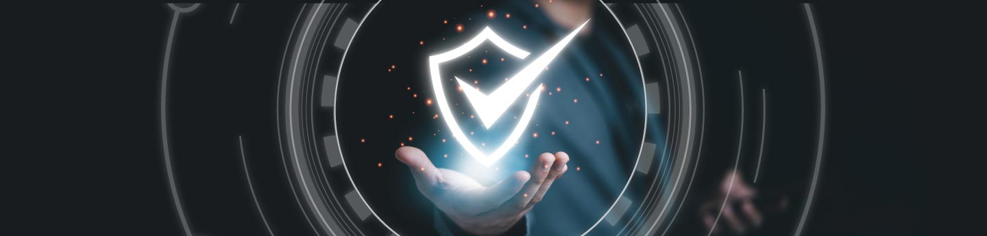 open hand with a glowing shield with a checkmark in the center floating above the palm