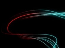 Teal and red swirling lines of light on a black background